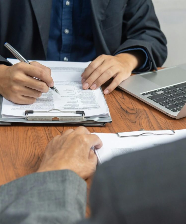 Manager or human resources is interviewing for employee job and resume application at office.